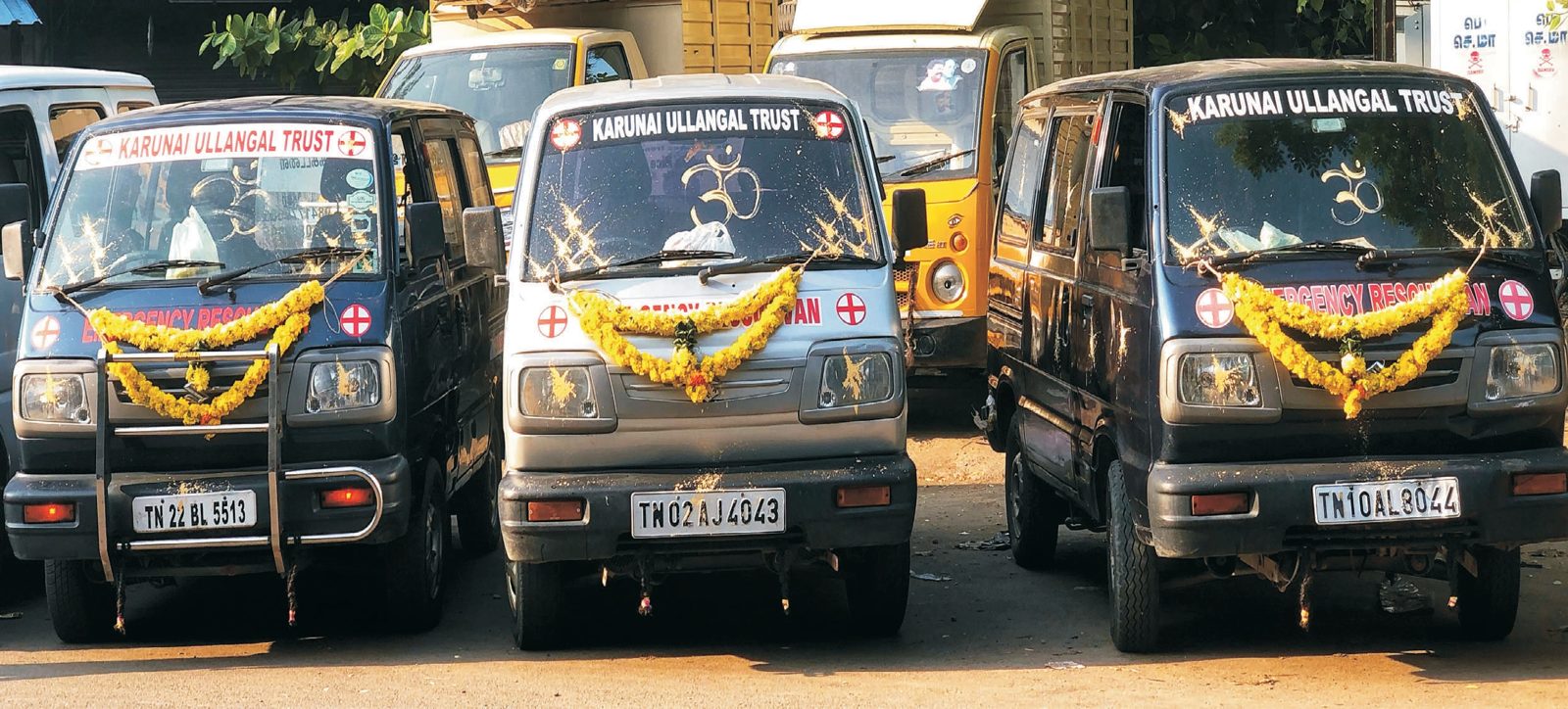 Garlanded Karunai Ullangal Trust free rescue ambulances lined up in Chennai