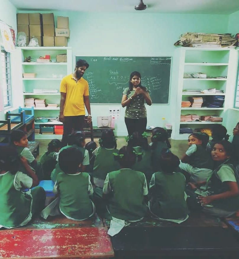 Children studying in a Karunai Ullangal Trust free evening tuition centre in Chennai